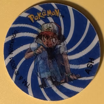 Ash — Tazo · 3D Tazos – Collectors Item · Tazo Nr. 1 · Englisch, Vorderseite