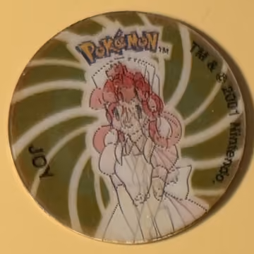 Joy — Tazo · 3D Tazos – Collectors Item · Tazo Nr. 2 · Englisch, Vorderseite